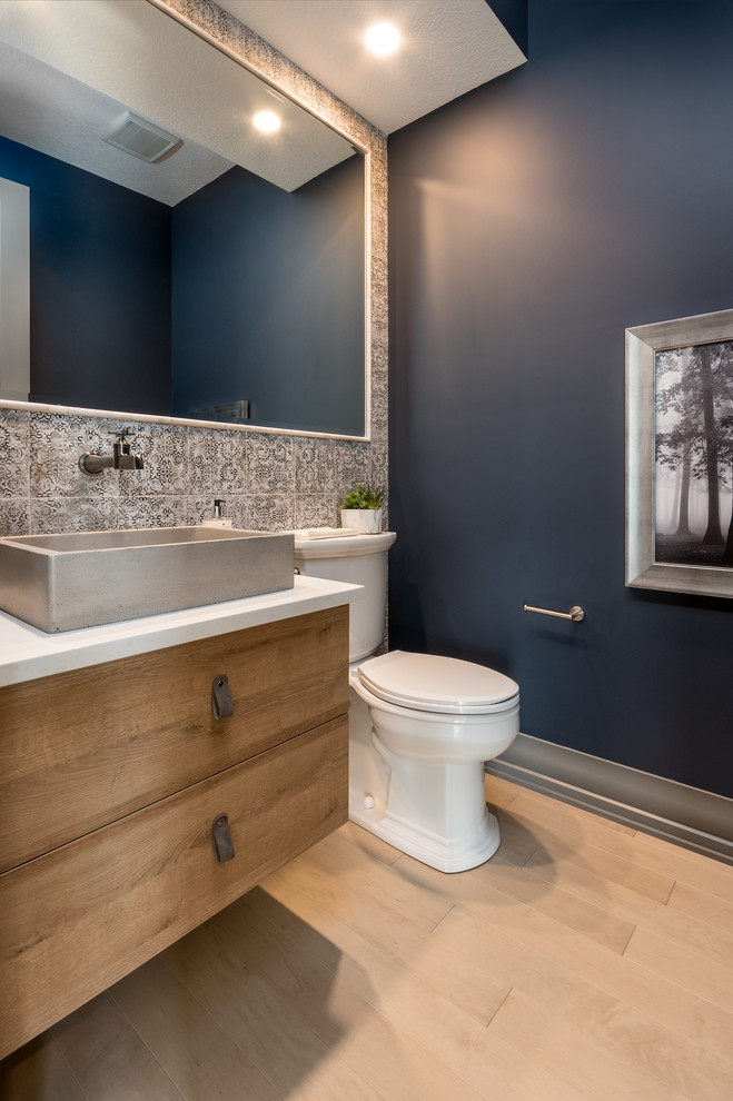 Example of a transitional home design design in Calgary