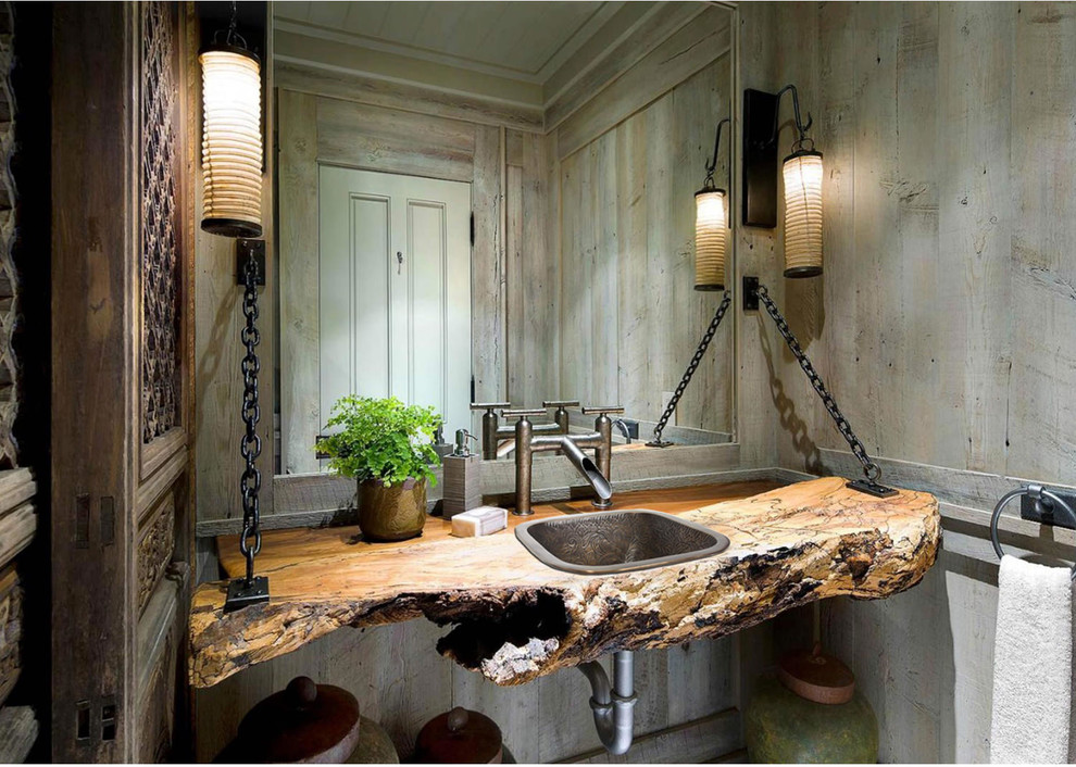 This is an example of a country powder room in Other with a drop-in sink, wood benchtops and brown benchtops.
