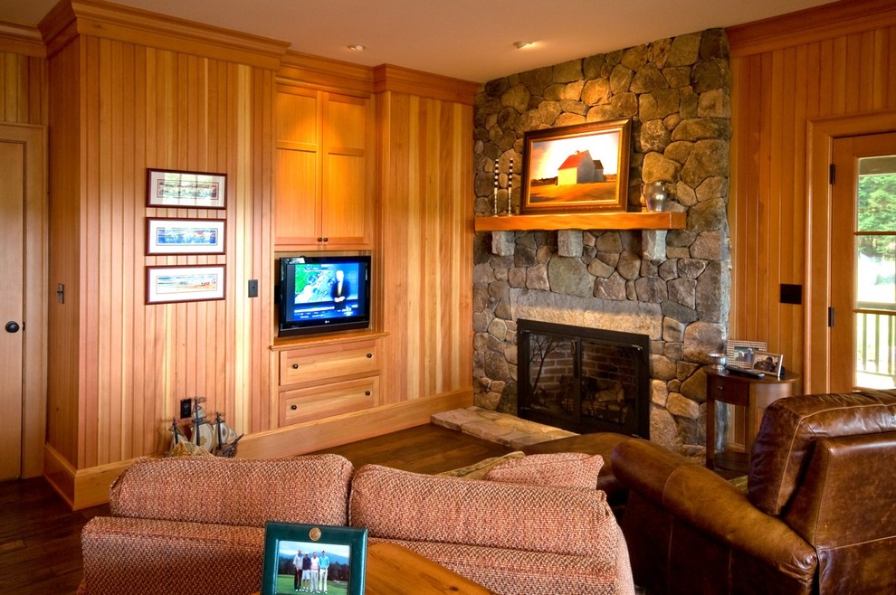 This is an example of a mid-sized traditional study room in Boston with dark hardwood floors, a standard fireplace and a stone fireplace surround.