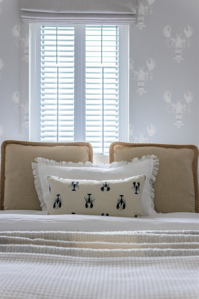 This is an example of a small coastal guest bedroom in Kent.