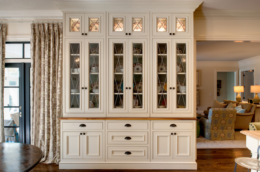 Home design - mid-sized transitional l-shaped medium tone wood floor home design idea in Atlanta with beaded inset cabinets, beige cabinets, wood countertops and an island