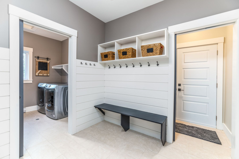Inspiration for a large transitional ceramic tile and beige floor mudroom remodel with gray walls