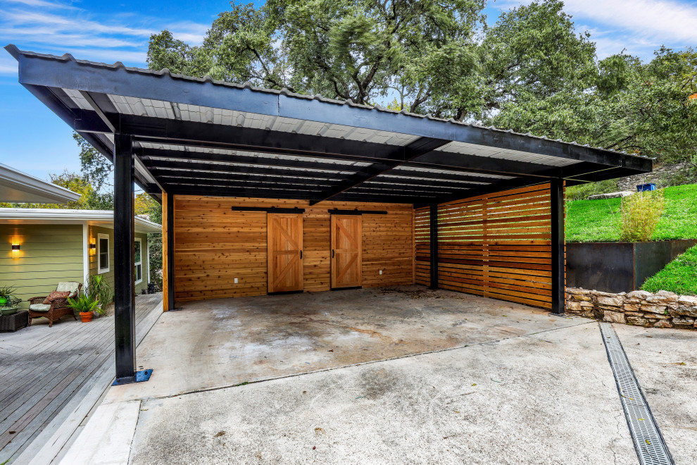 This is an example of a large contemporary detached two-car carport in Austin.