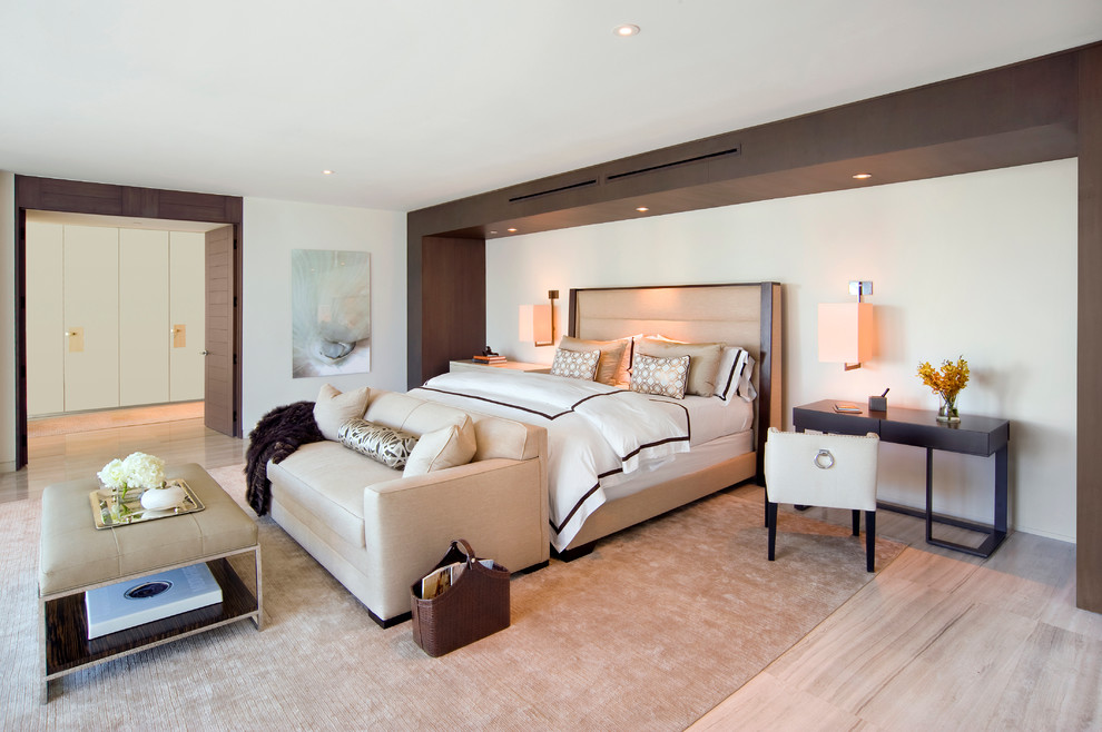 This is an example of a contemporary master bedroom in Miami with beige walls.