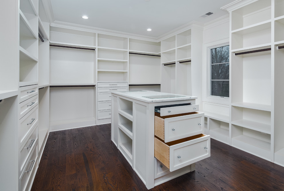 Inspiration for a large transitional gender-neutral walk-in wardrobe in DC Metro with shaker cabinets, white cabinets, dark hardwood floors and brown floor.
