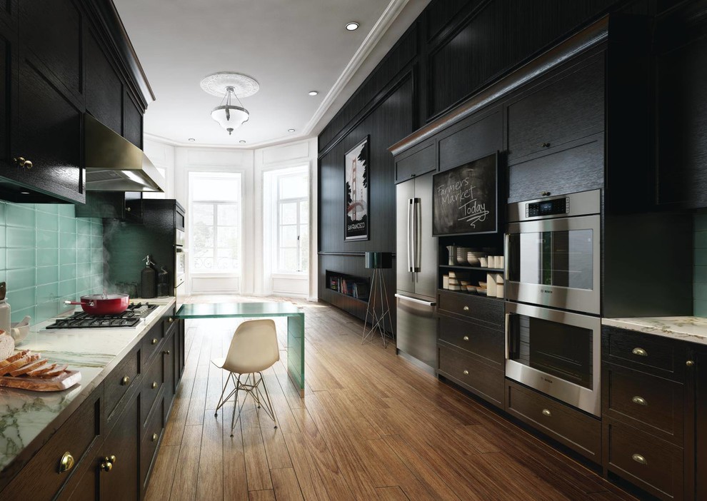 Inspiration for a large transitional galley medium tone wood floor and brown floor enclosed kitchen remodel with shaker cabinets, black cabinets, granite countertops, green backsplash, glass tile backsplash, stainless steel appliances and a peninsula