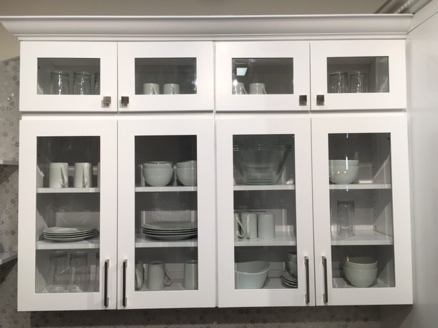 Mid-sized transitional l-shaped dark wood floor and gray floor enclosed kitchen photo in Orange County with white cabinets, gray backsplash, mosaic tile backsplash, stainless steel appliances, shaker cabinets, granite countertops and an island