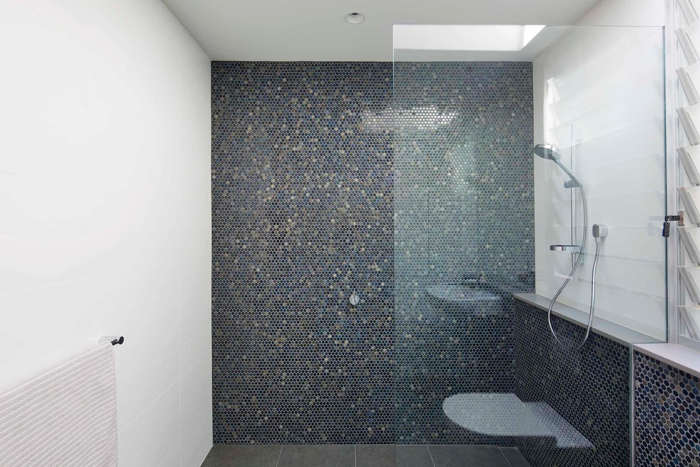 Inspiration for a mid-sized contemporary kids bathroom in Sydney with a one-piece toilet, blue tile, mosaic tile and a wall-mount sink.