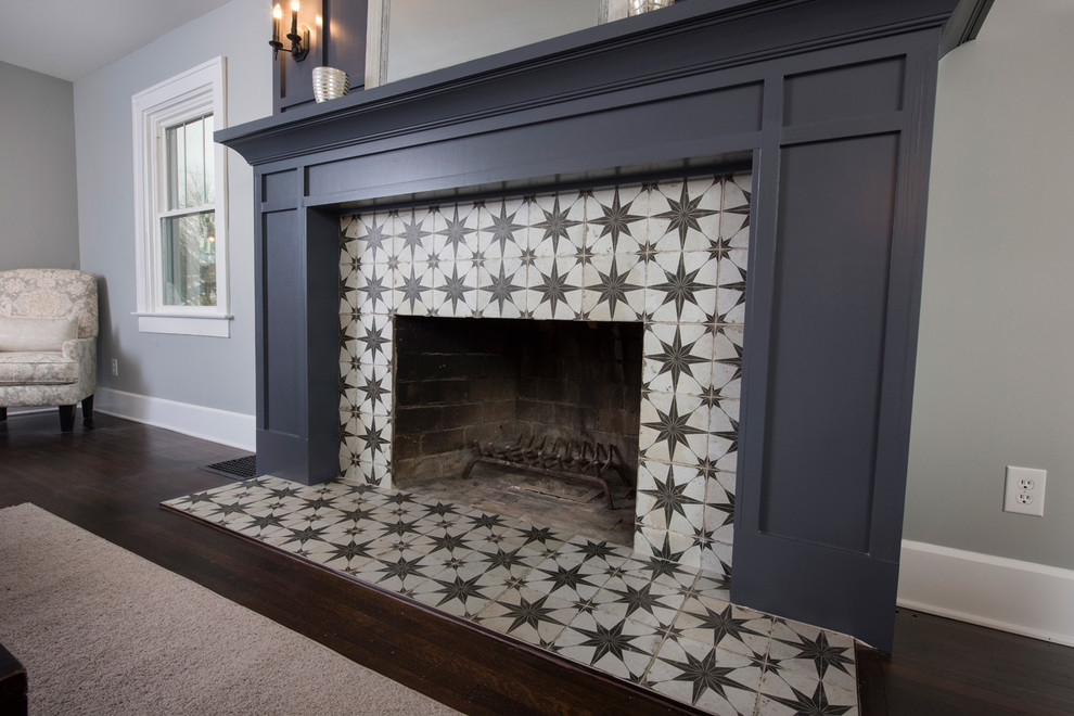 Inspiration for a formal open concept living room in Indianapolis with grey walls, dark hardwood floors, a standard fireplace and a tile fireplace surround.