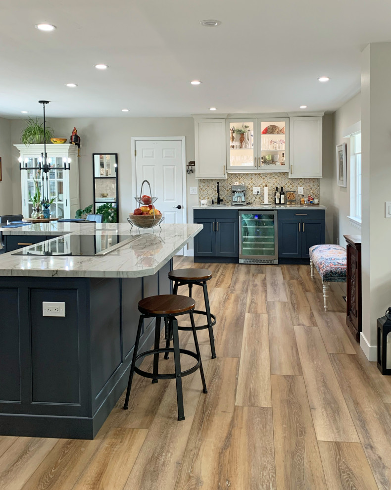This is an example of a mid-sized beach style wet bar in San Luis Obispo with an undermount sink, shaker cabinets, blue cabinets, quartzite benchtops, multi-coloured splashback, cement tile splashback and white benchtop.