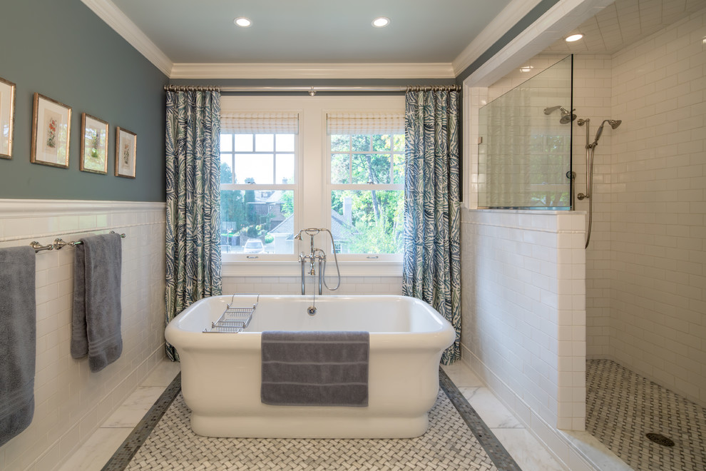 Photo of a traditional master bathroom in Minneapolis with white cabinets, a freestanding tub, an alcove shower, white tile and subway tile.