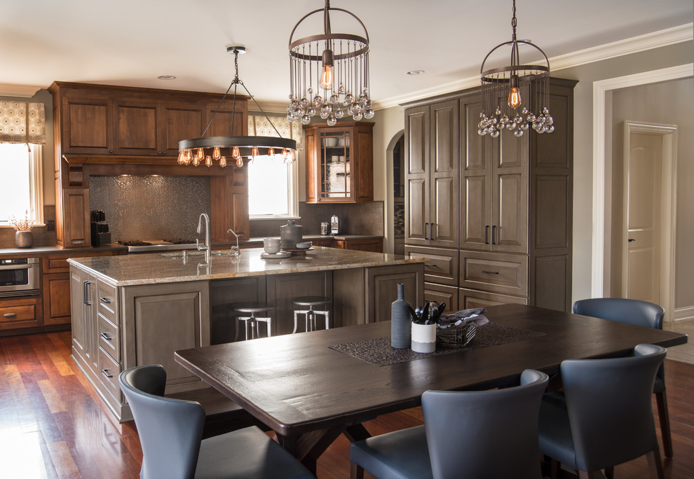 Inspiration for a mid-sized eclectic kitchen remodel in Chicago with raised-panel cabinets, gray cabinets, granite countertops, gray backsplash and an island