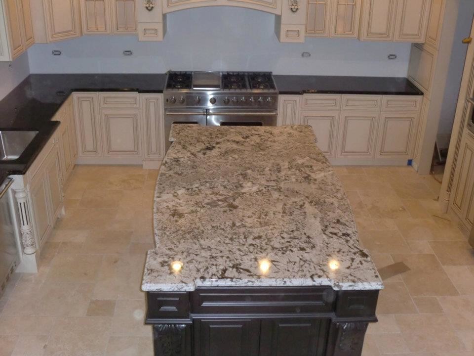 Kitchen - transitional kitchen idea in Chicago with an undermount sink, distressed cabinets, stainless steel appliances and an island