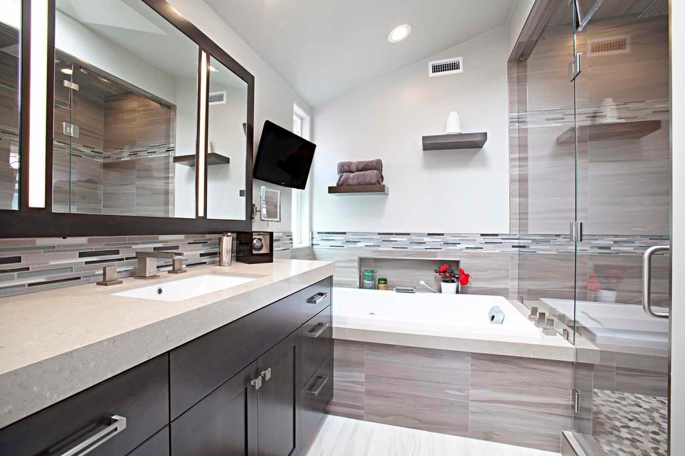 Mid-sized contemporary 3/4 bathroom in Orange County with flat-panel cabinets, dark wood cabinets, an alcove tub, an alcove shower, a two-piece toilet, beige tile, brown tile, gray tile, matchstick tile, beige walls, porcelain floors, an undermount sink and engineered quartz benchtops.