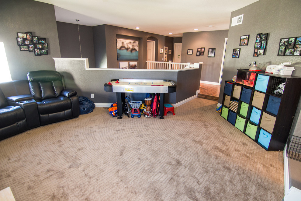 Design ideas for a mid-sized traditional gender-neutral kids' playroom in Los Angeles with grey walls and carpet.