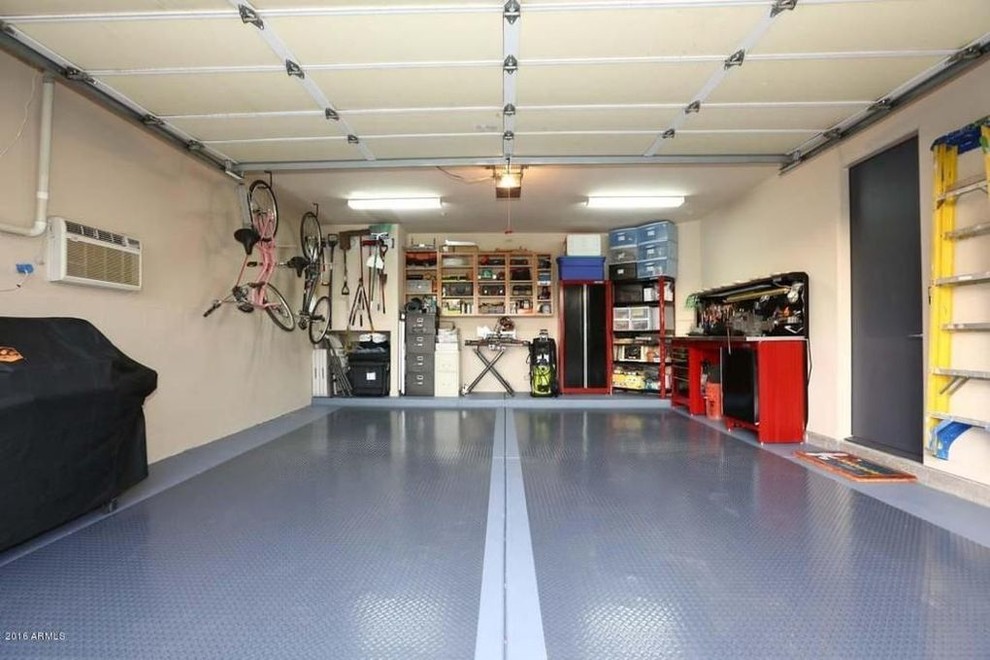 Photo of a mid-sized contemporary attached two-car garage in Phoenix.