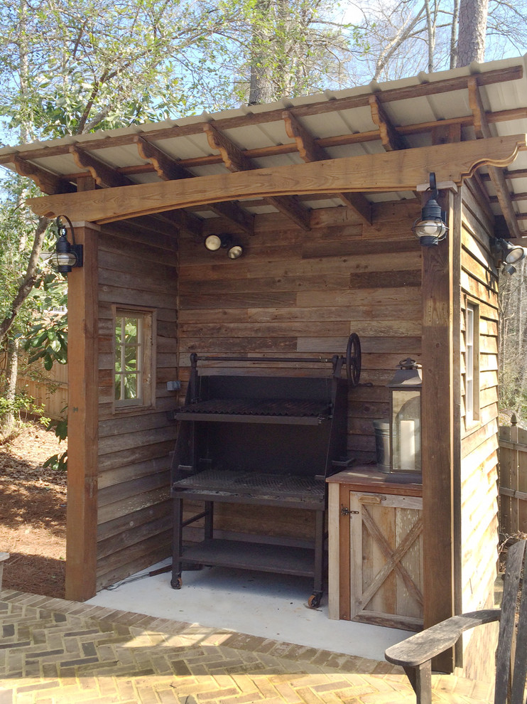 Photo of a country deck in Atlanta with an outdoor kitchen.