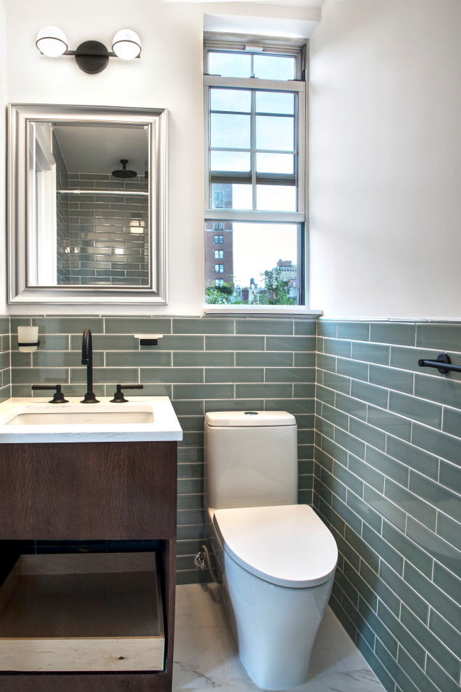 Small midcentury master bathroom in New York with brown cabinets, an alcove shower, a one-piece toilet, green tile, ceramic tile, grey walls, marble floors, a console sink, marble benchtops, grey floor, a hinged shower door, white benchtops, a single vanity and a freestanding vanity.