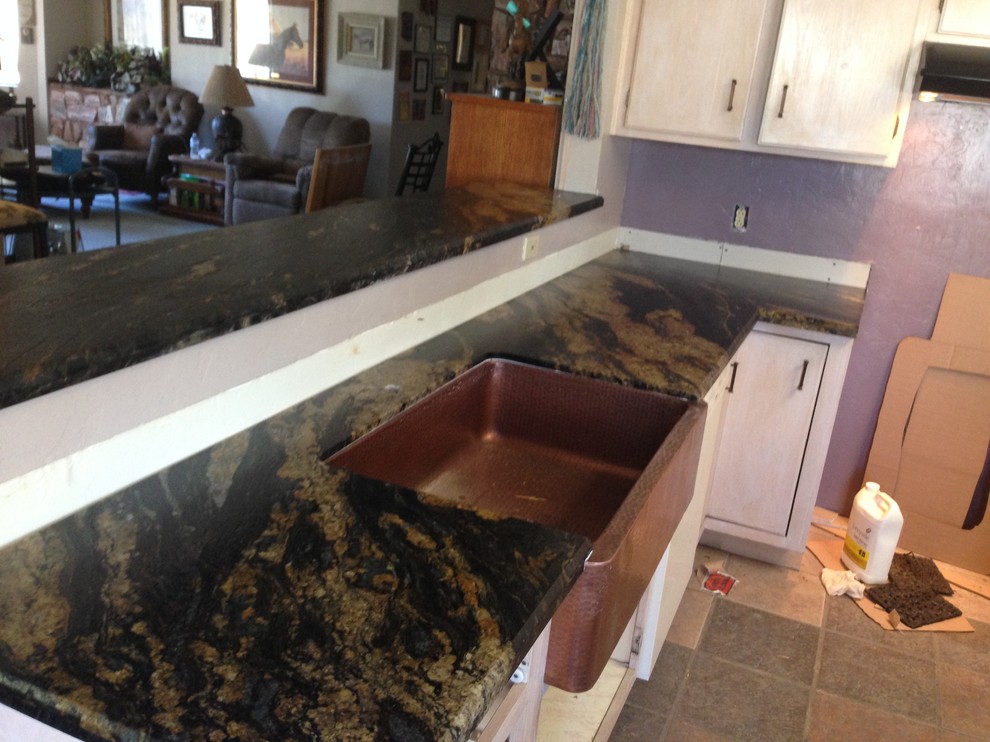 Eat-in kitchen - mid-sized transitional u-shaped porcelain tile and beige floor eat-in kitchen idea in Phoenix with a drop-in sink, recessed-panel cabinets, brown cabinets, granite countertops, green backsplash, stainless steel appliances, an island and gray countertops