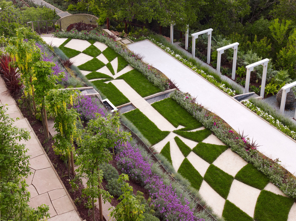 This is an example of a contemporary sloped full sun garden for summer in San Francisco.