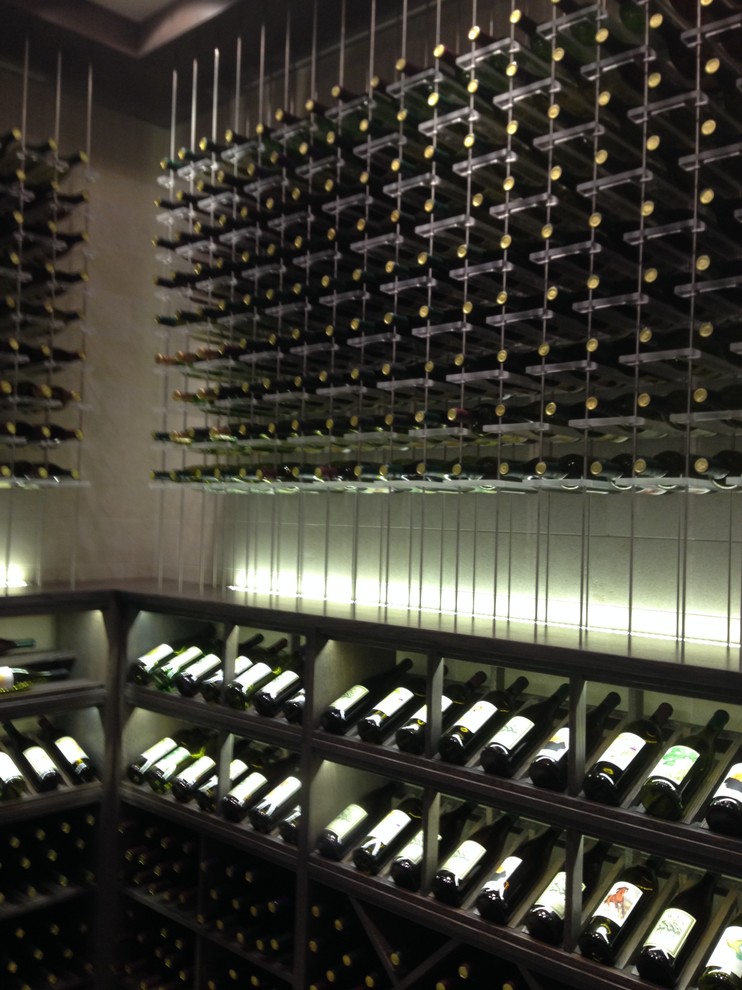 Inspiration for a mid-sized eclectic wine cellar in Los Angeles with ceramic floors and display racks.