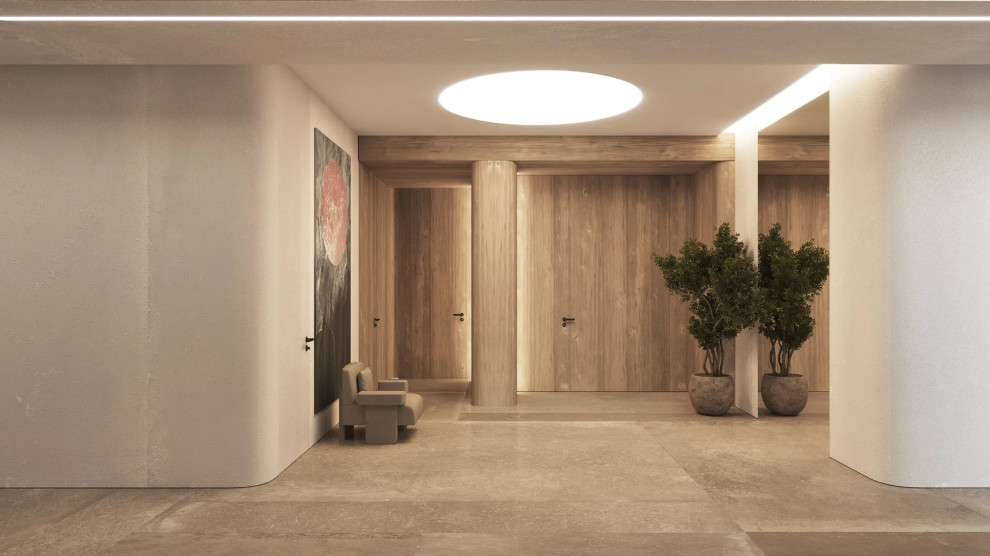 Aménagement d'un couloir moderne de taille moyenne avec un mur beige, un sol en marbre et un sol beige.