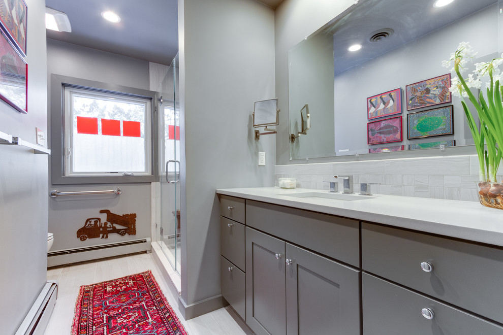 Photo of a contemporary bathroom in DC Metro with an undermount sink, shaker cabinets, grey cabinets, engineered quartz benchtops and a bidet.