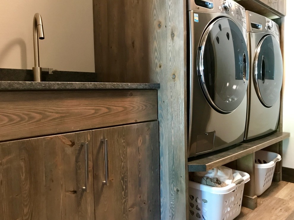Photo of a mid-sized modern dedicated laundry room in Other with an undermount sink, flat-panel cabinets, medium wood cabinets, granite benchtops, white walls, laminate floors, a side-by-side washer and dryer and beige floor.