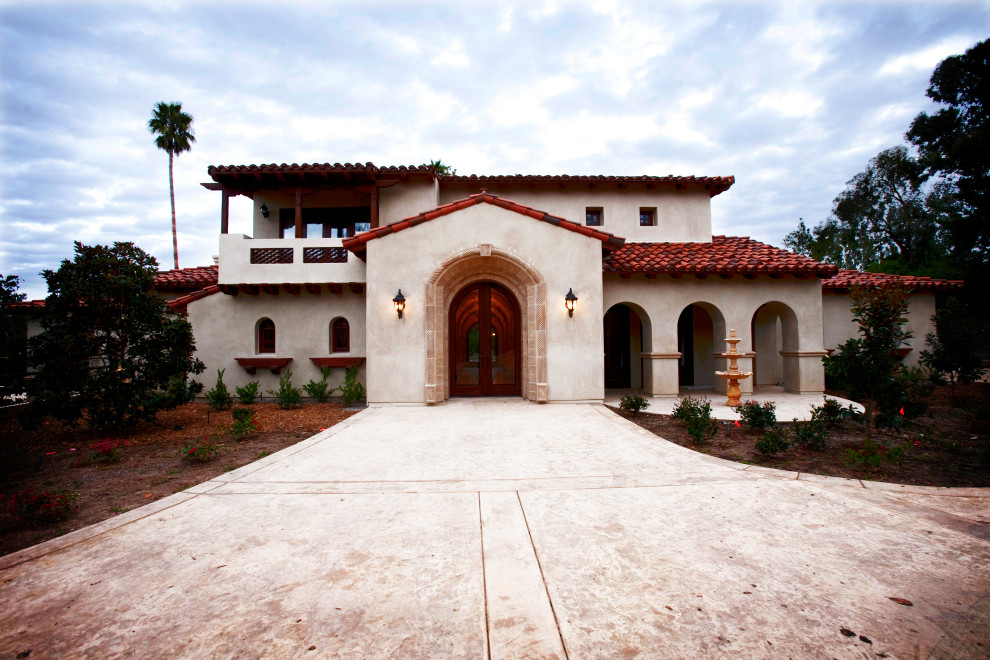 Example of a large tuscan exterior home design in Other