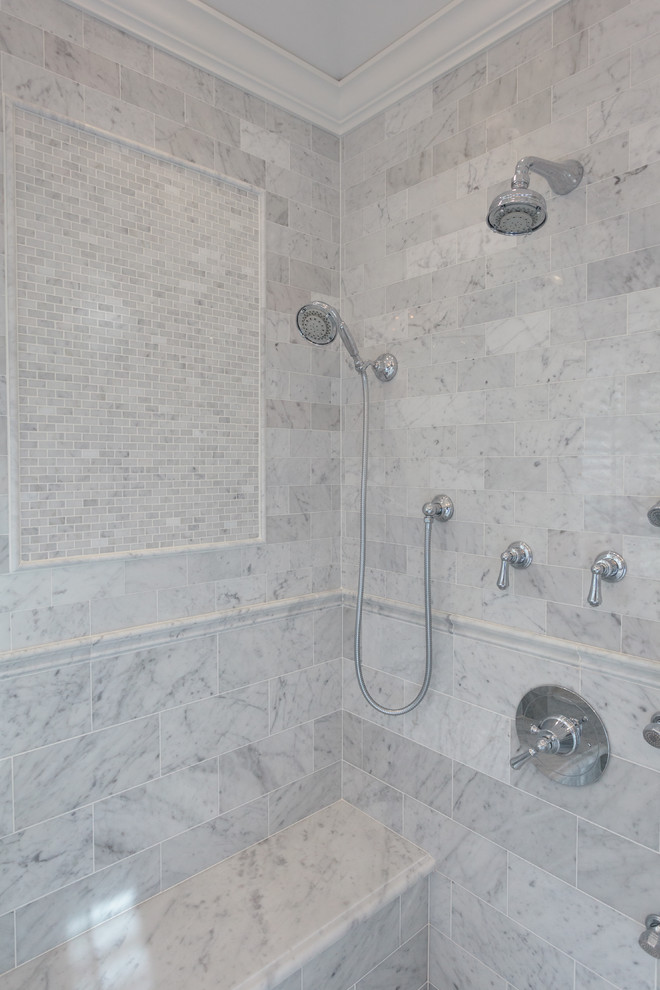 Design ideas for a large traditional master bathroom in New York with an undermount sink, marble benchtops, a freestanding tub, a corner shower, a two-piece toilet, white tile, stone tile, grey walls, marble floors, beaded inset cabinets and white cabinets.