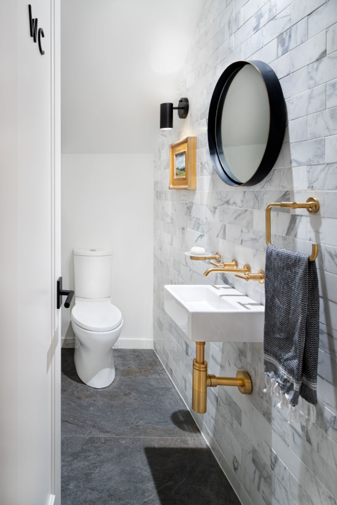 Design ideas for a small contemporary 3/4 bathroom in Austin with white cabinets, a two-piece toilet, black and white tile, porcelain tile, white walls, ceramic floors, a wall-mount sink, solid surface benchtops, white floor, white benchtops, a single vanity, a built-in vanity, timber and planked wall panelling.