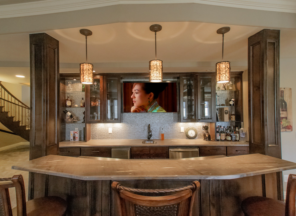 This is an example of a large transitional home bar in Denver with porcelain floors.