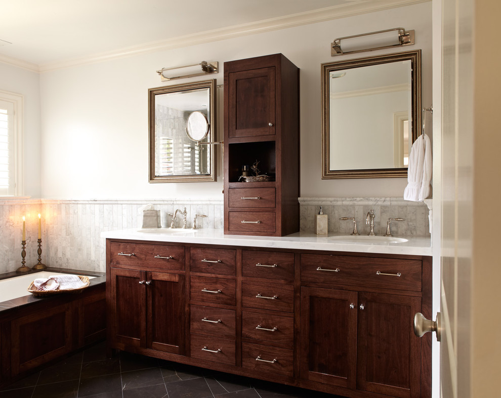 Mid-sized traditional master bathroom in San Francisco with an undermount sink, shaker cabinets, dark wood cabinets, an undermount tub, white tile, ceramic tile, quartzite benchtops, white walls and slate floors.