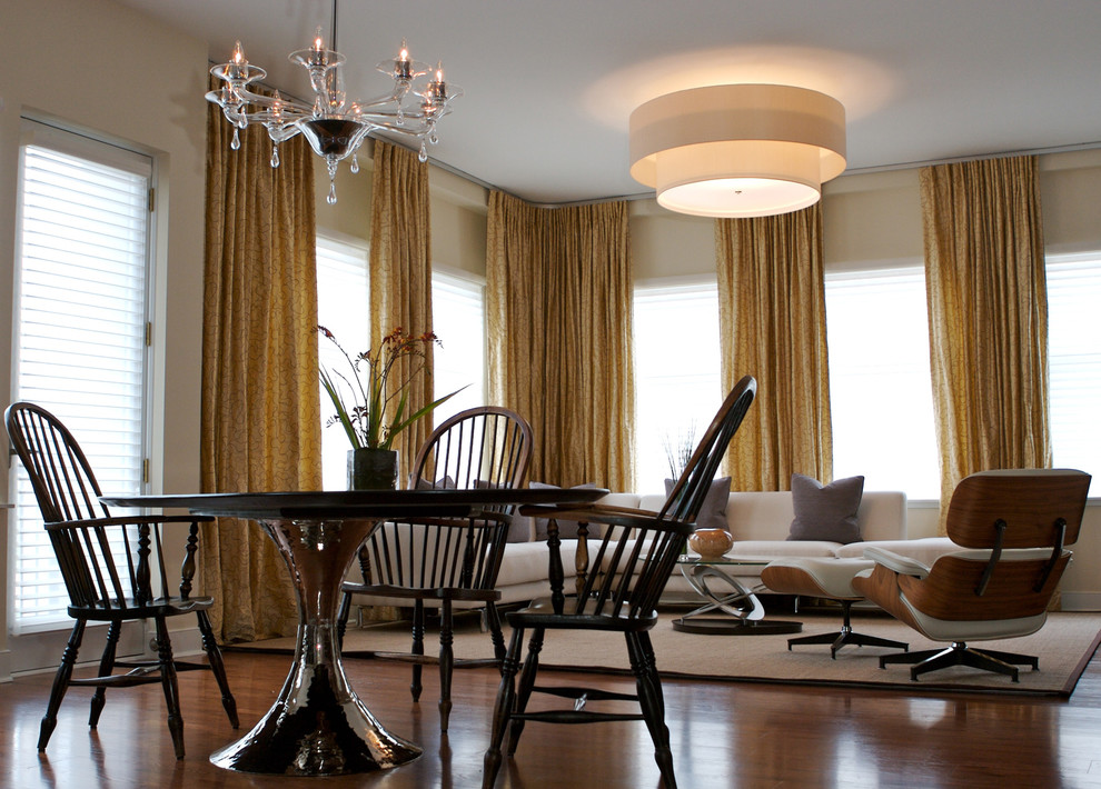 Design ideas for an eclectic dining room in Chicago with beige walls and dark hardwood floors.