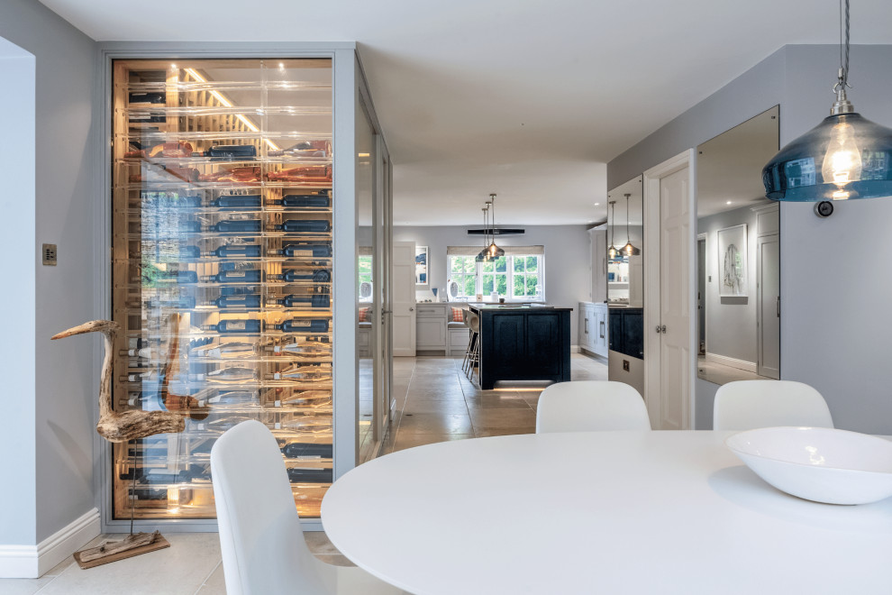 Design ideas for a mid-sized modern wine cellar in Essex with storage racks.