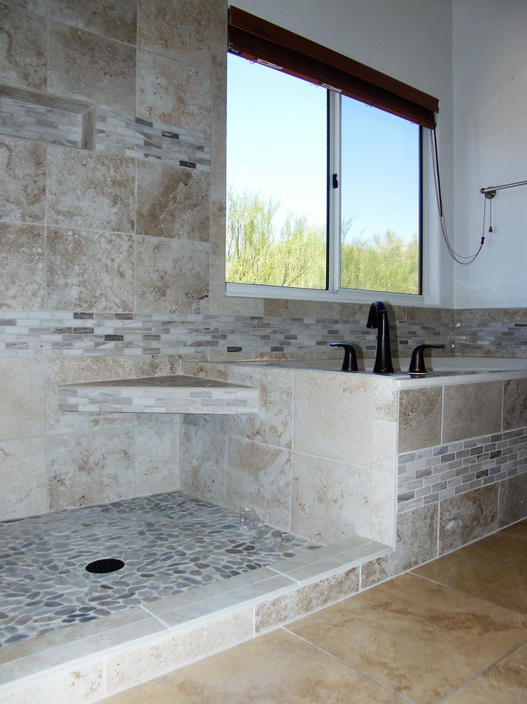 Mid-sized traditional master bathroom in Phoenix with a drop-in tub, an open shower, a one-piece toilet, beige tile, brown tile, ceramic tile, beige walls and ceramic floors.