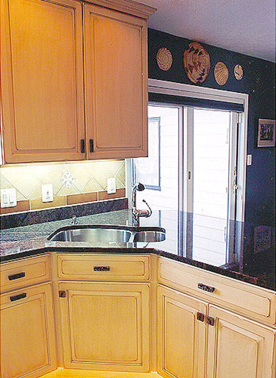 Kitchen - mid-sized kitchen idea in DC Metro with a double-bowl sink, light wood cabinets, beige backsplash and stainless steel appliances