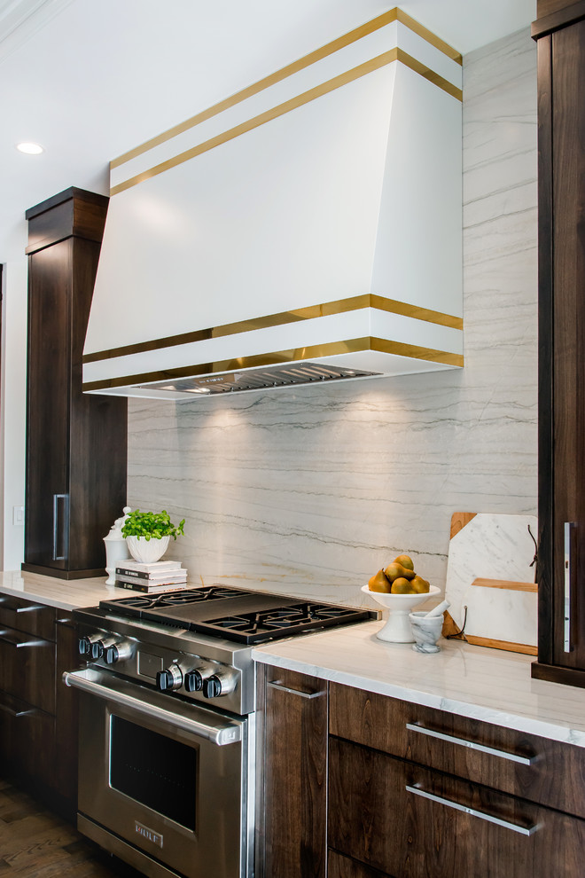 Inspiration for a large transitional l-shaped medium tone wood floor kitchen pantry remodel in Calgary with a double-bowl sink, flat-panel cabinets, marble countertops, white backsplash, stone slab backsplash, paneled appliances and an island