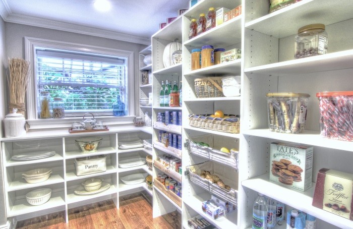 This is an example of a mid-sized traditional kitchen pantry in New York with open cabinets.