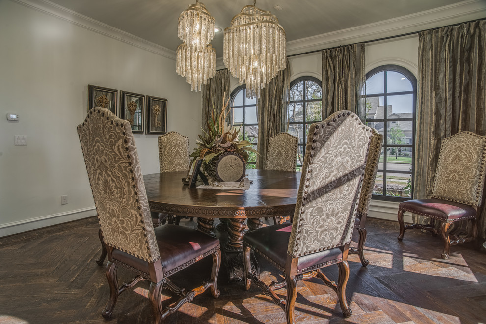 Large traditional separate dining room in Austin with dark hardwood floors and beige walls.