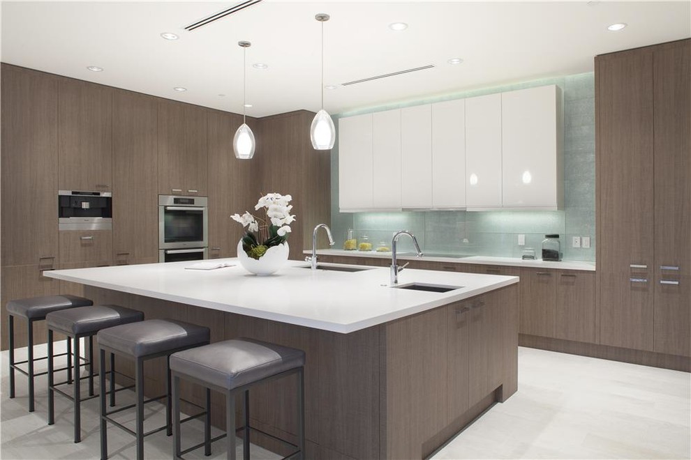 Design ideas for a large modern single-wall open plan kitchen in New York with an undermount sink, flat-panel cabinets, dark wood cabinets, stainless steel appliances, porcelain floors, no island and grey floor.