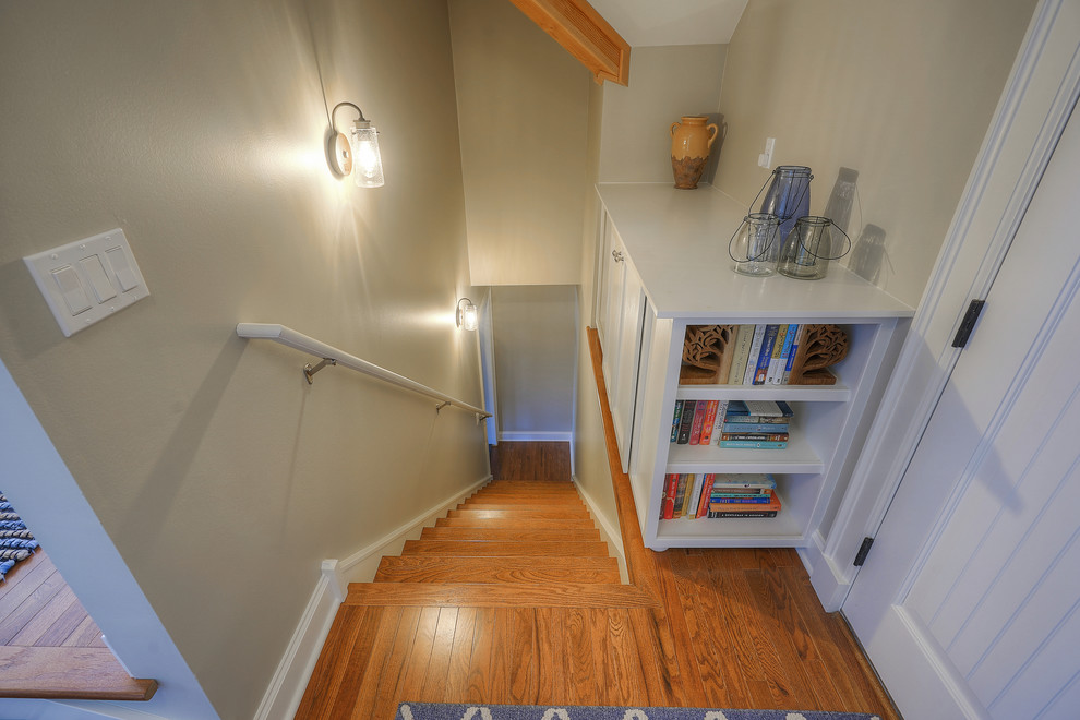 Design ideas for a mid-sized traditional wood straight staircase in Seattle with wood risers and wood railing.