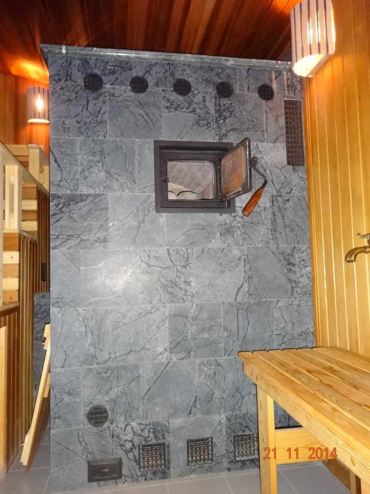 Печь-каменка. Облицована арх. С.Елисеевым. Талькохлорит, чугун. решетки.