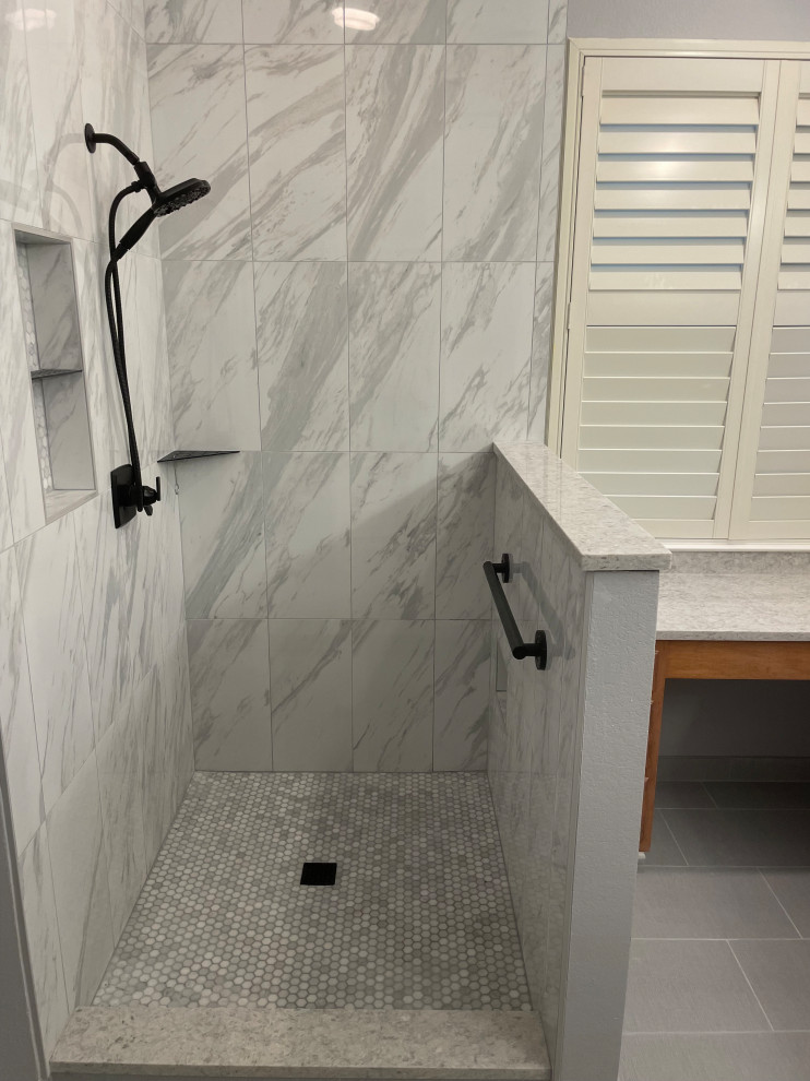 Design ideas for a large contemporary master bathroom in Austin with an alcove shower, white tile, porcelain tile and a niche.
