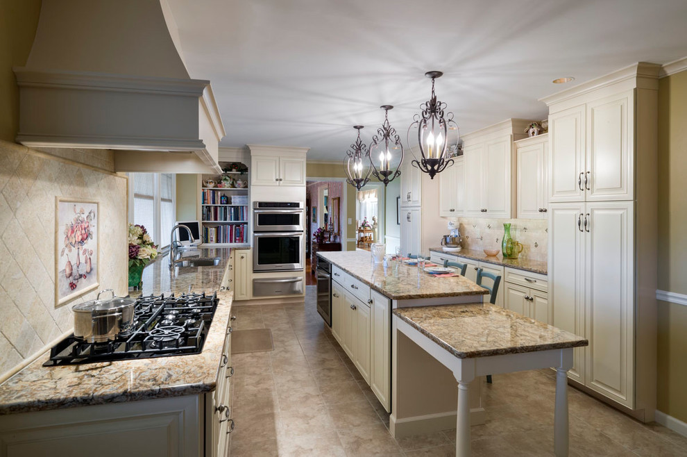 Large traditional u-shaped eat-in kitchen in Philadelphia with a single-bowl sink, marble benchtops and with island.