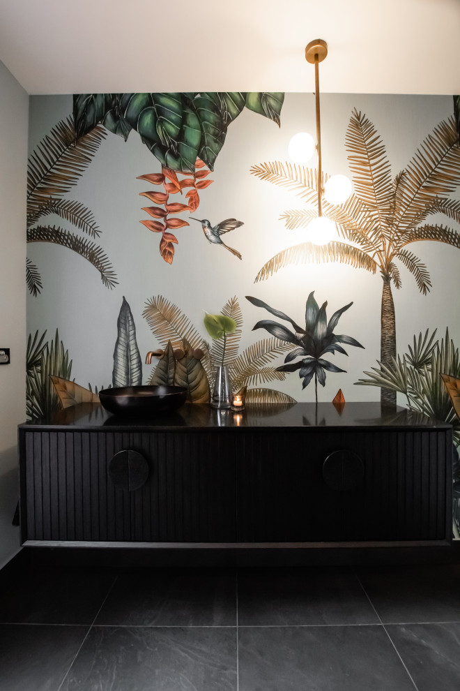 Inspiration for a mid-sized contemporary kids bathroom in Sydney with black cabinets, a corner shower, a two-piece toilet, black tile, white walls, a vessel sink, grey floor, a hinged shower door, black benchtops, a single vanity and a floating vanity.