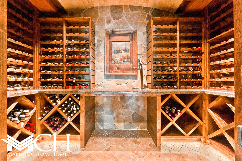 Inspiration for an expansive arts and crafts wine cellar in Dallas with brick floors and storage racks.