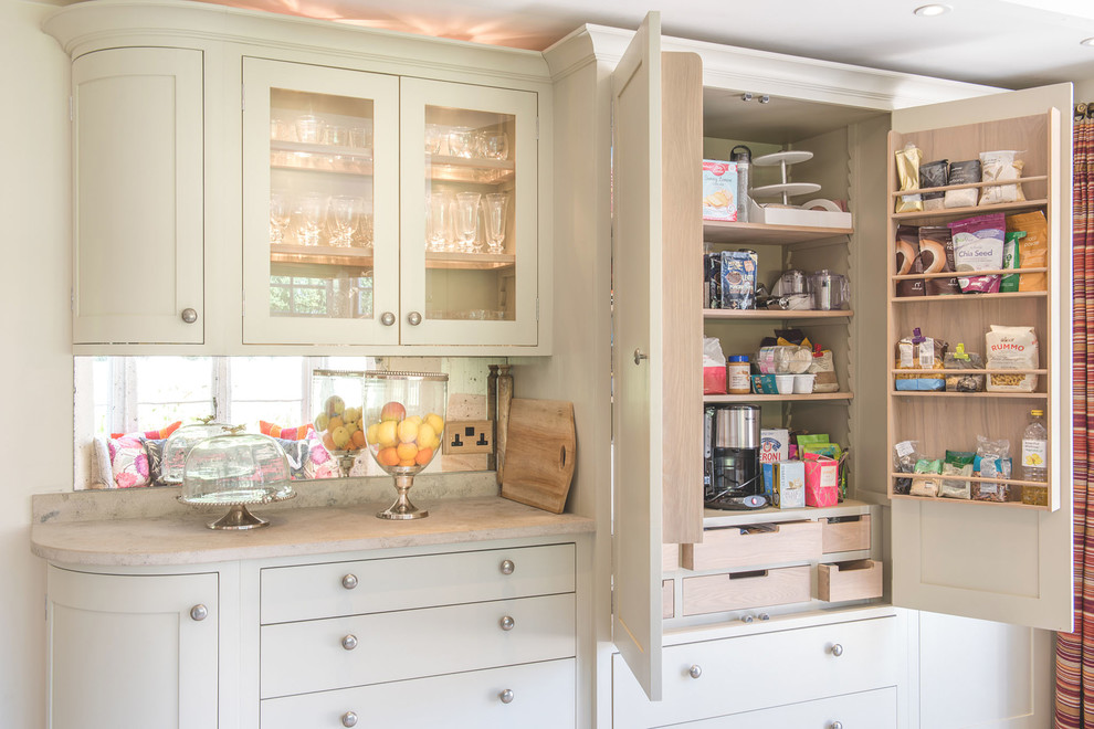 Inspiration for a small traditional l-shaped eat-in kitchen in Berkshire with a farmhouse sink, shaker cabinets, grey cabinets, limestone benchtops, metallic splashback, mirror splashback, panelled appliances, ceramic floors and no island.