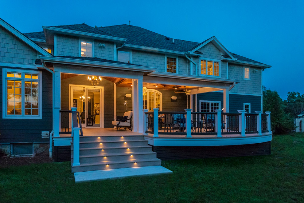 Deck - large craftsman backyard deck idea with a roof extension