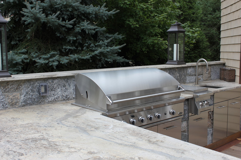 Inspiration for a large transitional backyard deck remodel in Bridgeport with a fire pit and no cover